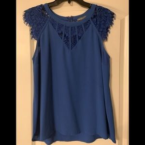 Ladies top with delicate touches at neckline and sleeves